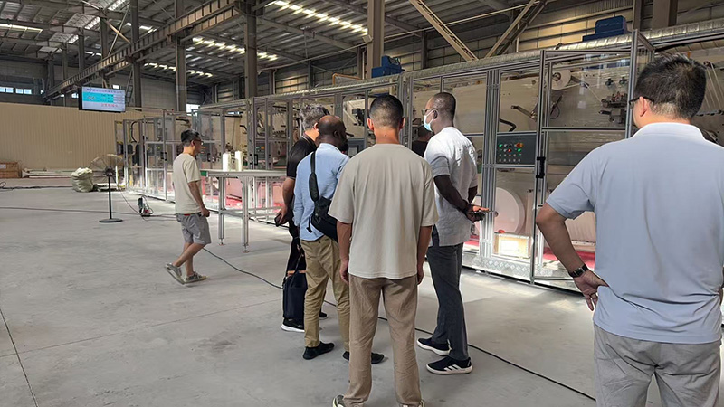 Bangladeshi Clients Visit RX Factory for Sanitary Napkin Machine Inspection